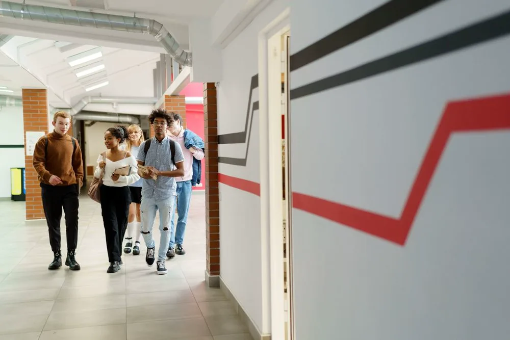 Students walking together along a school corridor
