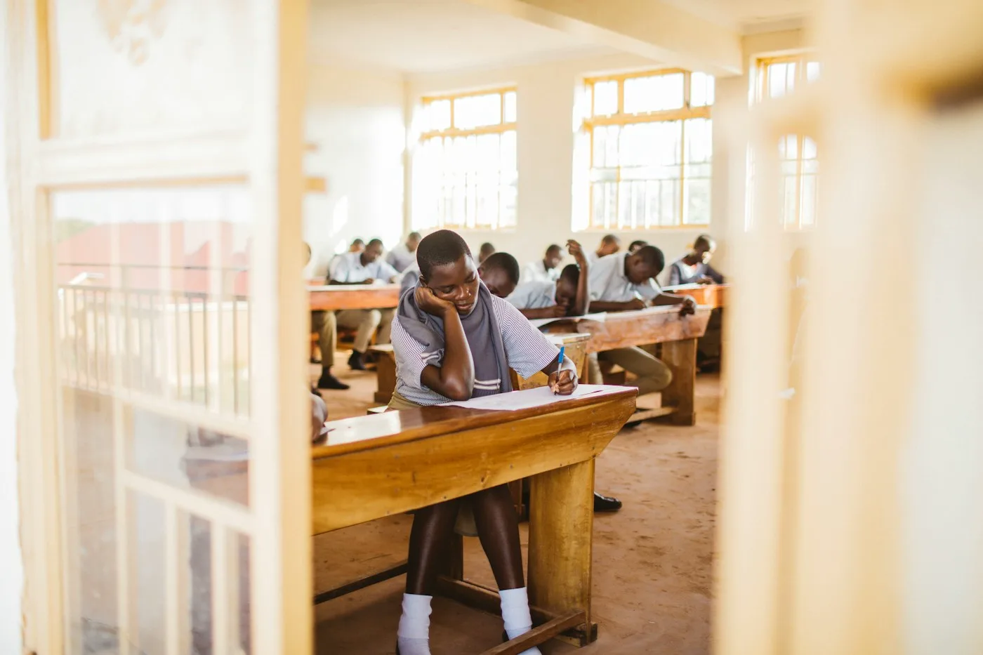 Senior students working at their desks in a bright classroom